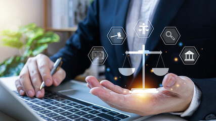 Legal advice business concept, businessman holding virtual global law icons on for business legal advice, Regulations and laws, Lawyer, Attorney at law, Advice on digital technology and business.