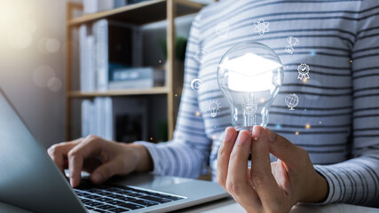 businesswoman hand holding light bulb with Internet education course degree, Elearning graduate certificate program concept, study knowledge, creative thinking idea, AI, problem solving solution.