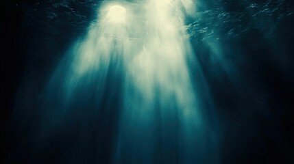 Minimalist black background with soft lighting from above, creating a subtle contrast for design elements.