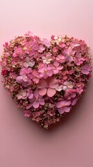 Obraz premium A beautiful heart-shaped collection of pink flowers sits against a soft pastel background. The delicate petals create a striking visual effect, perfect for celebrations, romantic gestures, or nature-t