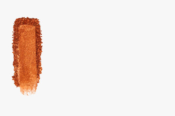Smear of eyeshadow on a light background. Beauty product, cosmetic application.