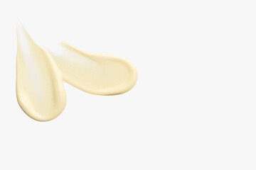 Composition of yellow cream smears on a light background. Skincare product, beauty textures, citrus...
