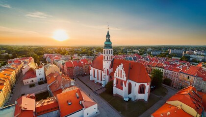 aerial high angle view of the parish of st john the baptist and old town buildings at sunset...