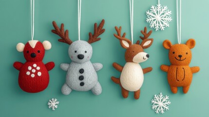 Obraz premium Cute felt animal Christmas ornaments with snowflakes on teal background