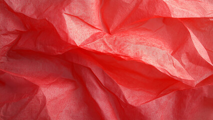 Crinkled Red Tissue Paper – Vibrant red tissue paper with a crinkled, translucent texture