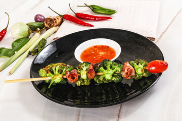 Thai Street foof satay with bacon and broccoli