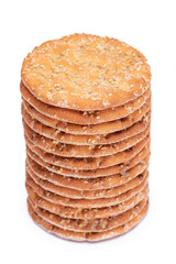 A Stack of Round Salt Crackers with Sesame Isolated on White Background. Dry Snacks - Isolation