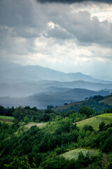 Naklejka premium Rainy landscape and mountains in the background