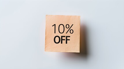 Black '10% OFF' Text on a Peach Fuzz Square Paper Note. White Background with Copy Space