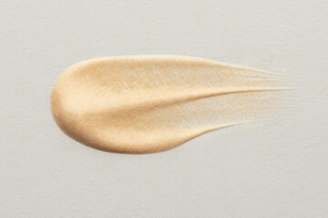 Obraz premium Smears with foundation texture on white isolated background