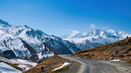A high-altitude mountain pass with snow-capped peaks and a winding road, dramatic setting with clear blue skies, Adventurous style