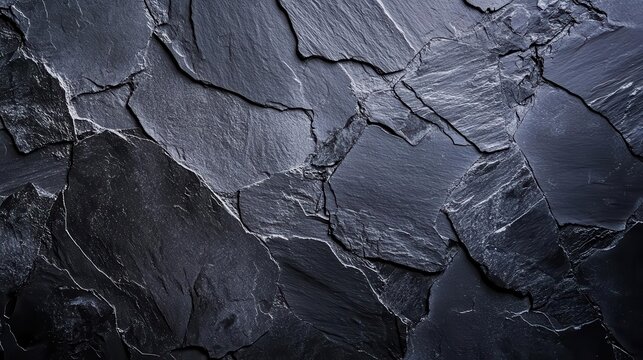 dark grey black slate texture background with varying patterns of black stone, conveying a sense of sophistication and strength