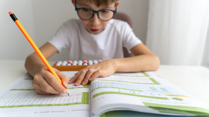 boy doing mental arithmetic on abacus