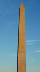 The monument tower view with the sunset sky as background in Washington DC
