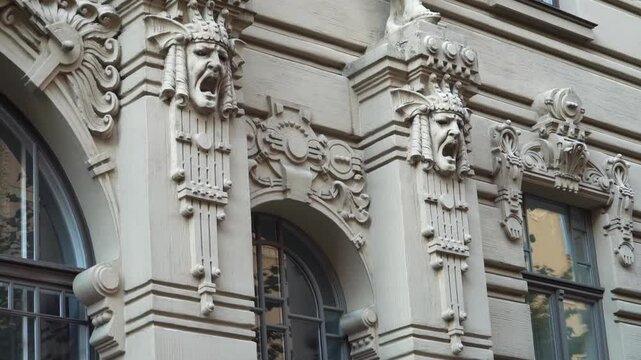 This close-up of a famous Art Nouveau building facade on Riga's Albert Street (Latvia) demonstrates the unique blend of Jugendstil architectural and sculptural elements.