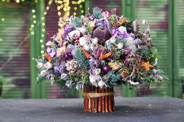 Christmas winter bouquet of pine needles with lilac decor for interior decoration