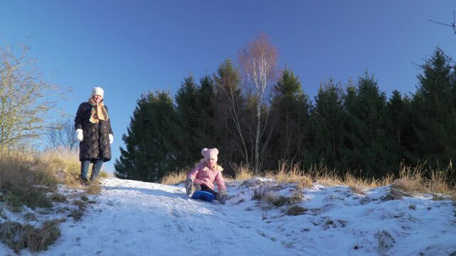 Kids bobsledding