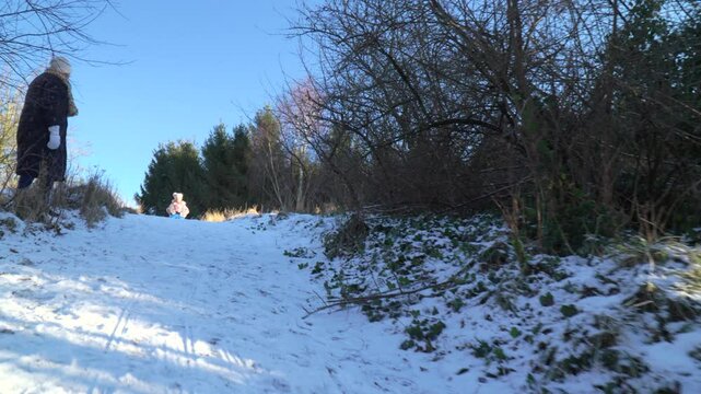 Kids bobsledding