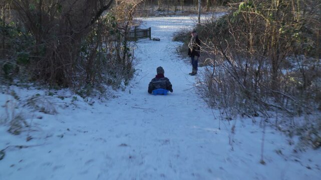 Kids bobsledding