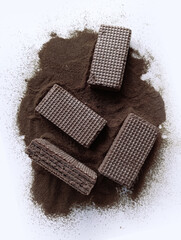 chocolate wafers with instant coffee powder on white background
