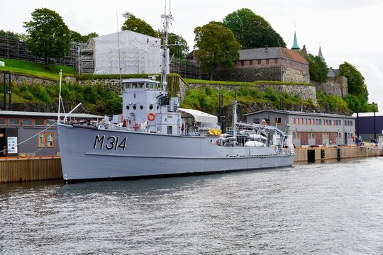 Decommissioned minesweeper KNM Alta moored beneath Akershus Fortress in Oslo, Norway