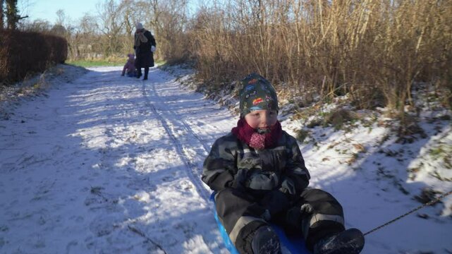 Kids bobsledding