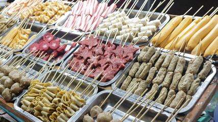 Various kinds of satay are displayed in festival night street food