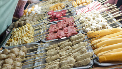 Various kinds of satay are displayed in festival night street food