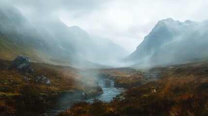 Panoramic shot of the Fairy Pools on a misty day, with the surrounding mountains adding a dramatic backdrop. No people included.