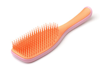 Orange plastic hair brush