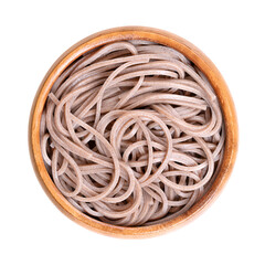 Cold soba noodles in a wooden bowl, isolated from above. Thin Japanese noodles made primarily from...