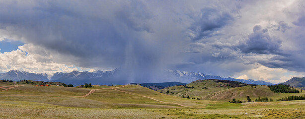 heavy lilac clouds above Altai mountains