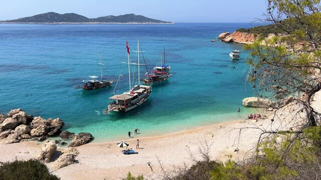 Soguk Su Koyu, Cold Water Bay, is a beach in Turkey located in the Fethiye district of Mugla Province. It is surrounded by mountains, vegetation, and has blue water. The beach is lined with yachts.4К
