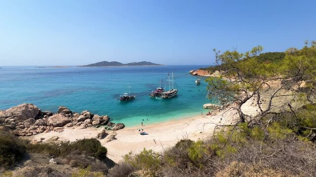 Soguk Su Koyu, Cold Water Bay, is a beach in Turkey located in the Fethiye district of Mugla Province. It is surrounded by mountains, vegetation, and has blue water. The beach is lined with yachts.4К