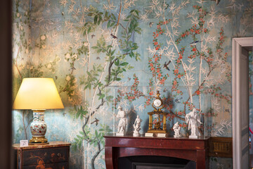 Wall decoration with antique wallpaper and furniture in the Château de Maintenon in France