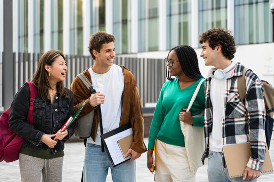 Happy university student friends together in the College campus. Diversity in global education 