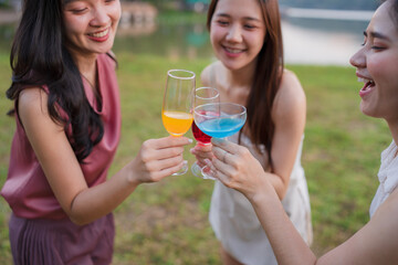 Asian women celebrating, meeting and chatting in a bar. Places to visit, beautiful lights