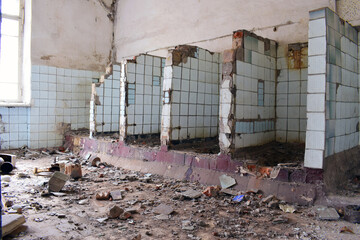 a ruined room, a public toilet. destruction, abandoned premises. partitions between toilets. Mental Hospital Bathroom. old abandoned premises, ruin. empty territories, abandoned houses