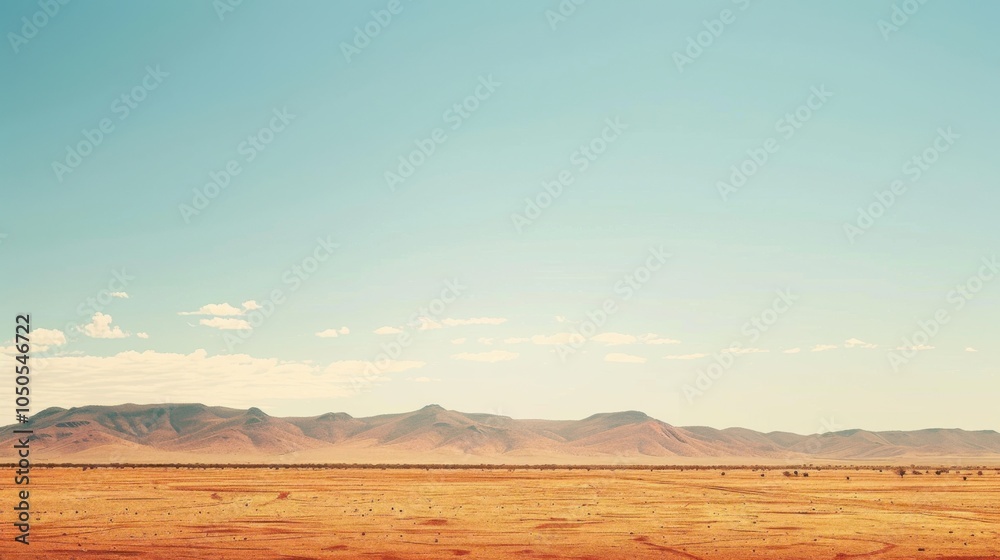 Poster a serene view of the australian outback with vast red deserts and distant mountain ranges under a br