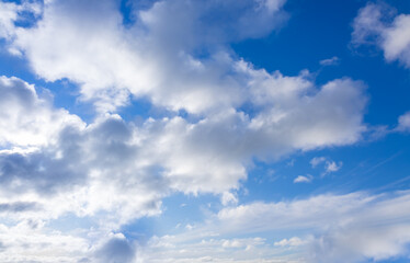 Beautiful blue sky and white fluffy group of clouds background in the morning skyline