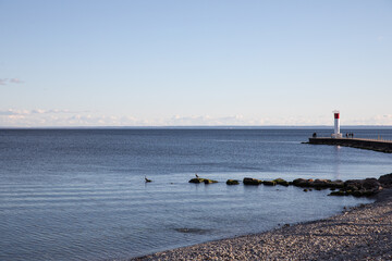 pier in the Lake Ontario, Canada. Lighthouse on Lake.