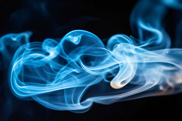 Obraz premium abstract blue smoke swirling on black background