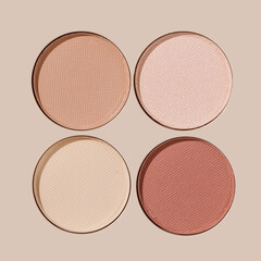 Eyeshadow palette, mix of glitter, matte shades in beige, brown, pink, purple hues. Minimal top view pattern for beauty, makeup, cosmetic themes, Vivid color swatches eyeshade refills round shape