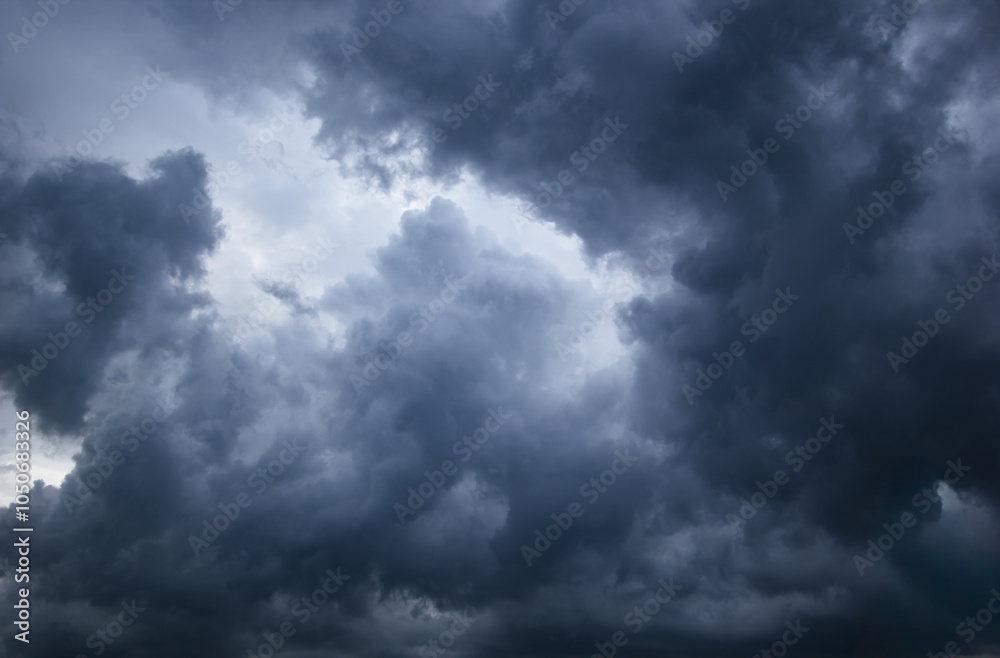 Poster the dark sky with heavy clouds converging and a violent storm before the rain.bad or moody weather s