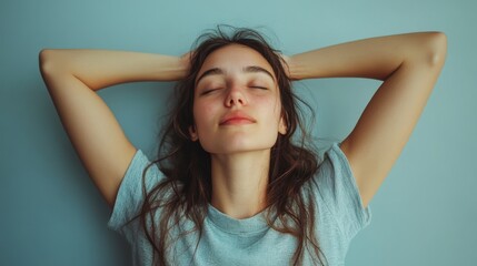 Fototapeta premium Portrait of a Young Woman with Eyes Closed and Arms Raised
