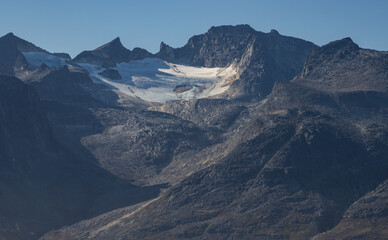 View of icebergs and mountains in the fjords of south Greenland
