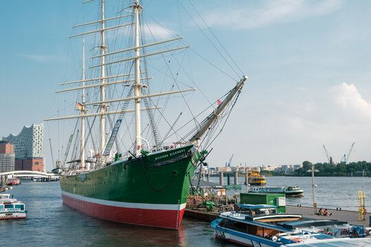 Hamburg, Germany - 04.09.2024: The old sailing ship Rickmer Rickmers on the banks of the Elbe with the Elbphilharmonie concert hall in the background of the city of Hamburg.
