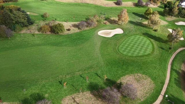 A breathtaking aerial photograph beautifully displaying a meticulously maintained golf course landscape