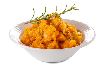 Butternut squash stew with rosemary sprig in white porcelain bowl isolated on white with clipping path included.