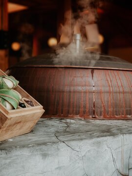 A big pot simmering in a food market